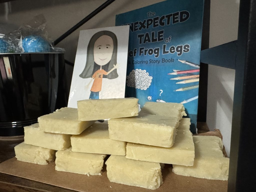 Stack of homemade soap on shelf.